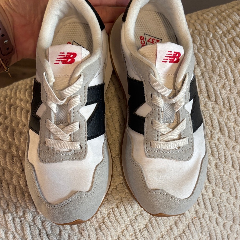 New Balance Kids Sneakers in White, Gray & Black with Red Logo